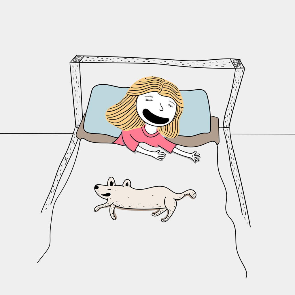 ベッドで寝ている女の子と犬